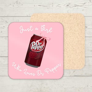 May include: Pink square coaster with the text "Just a Girl Who Loves Dr Pepper" and a can of Dr Pepper with a pink ribbon on top.