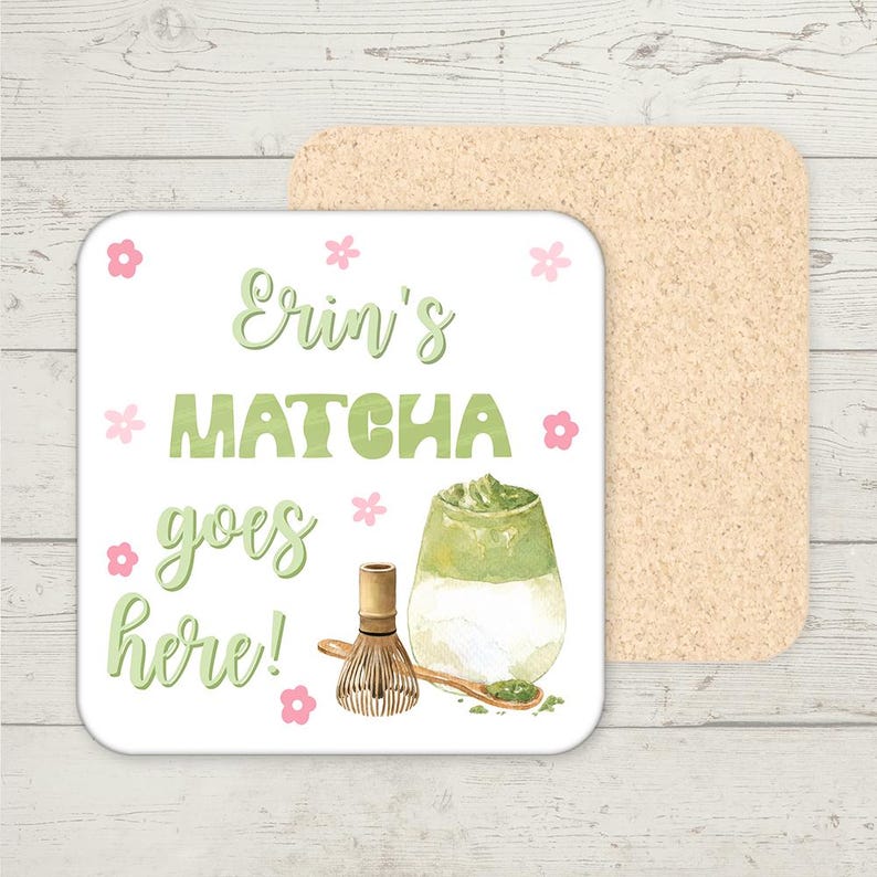 May include: White ceramic coaster with the text "Erin's Matcha goes here!" in green and pink lettering. The coaster features a green and white matcha latte, a bamboo whisk, and a spoon with matcha powder on a white background.