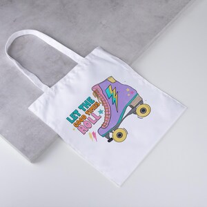 May include: White tote bag with a colourful illustration of a roller skate and the text "Let the Good Times Roll." The roller skate is purple, pink, and yellow.