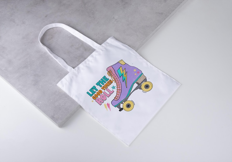 May include: White tote bag with a colourful illustration of a roller skate and the text "Let the Good Times Roll." The roller skate is purple, pink, and yellow.