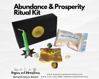 May include: A black box with the words "Abundance & Prosperity Ritual Kit" on the top. The box contains a green candle, a small pouch with a gold and floral design, a small bag of bath salts, and several crystals. The text "Poppies and Moonstones Metaphysical Magic" is on the bottom of the image.