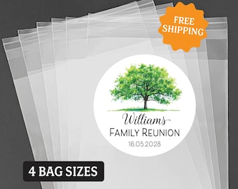 May include: A stack of clear plastic resealable bags featuring a circular white sticker with a green watercolor tree illustration. The sticker text reads Williams FAMILY REUNION 16.05.2028. A black rectangular label indicates 4 BAG SIZES.