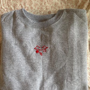 She-Ra Heart of Etheria Failsafe symbol hand embroidered sweater, first ones language, nerdy gifts, catra and adora, cosplay