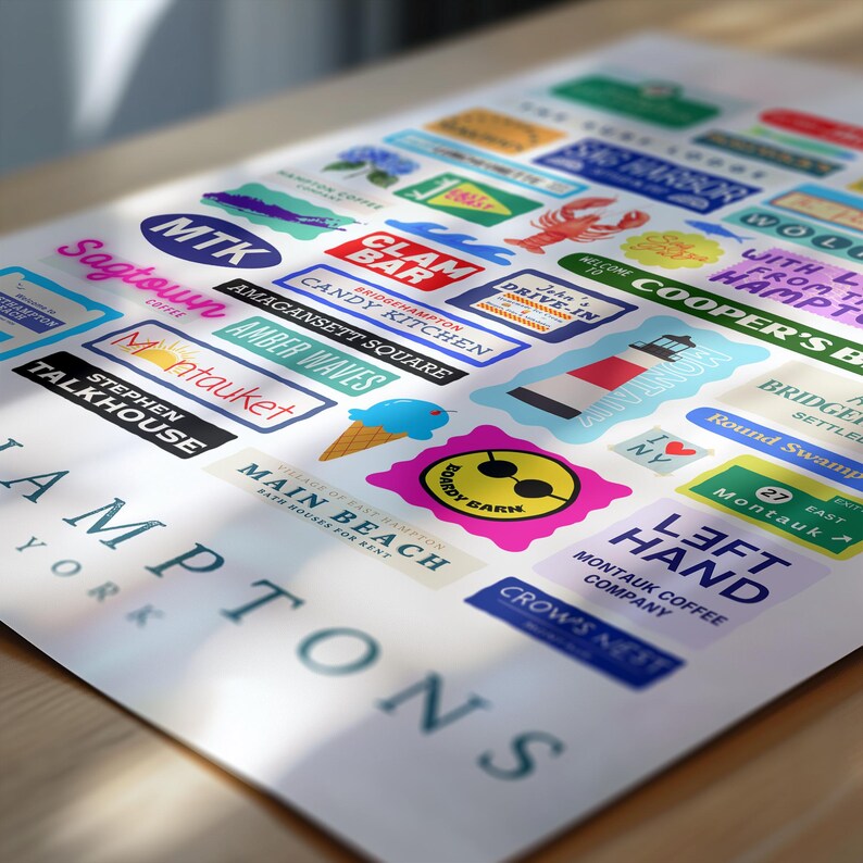 May include: A poster featuring a collection of colorful stickers and labels, many with text. The stickers include a lobster, an ice cream cone, and the words "Hampton" and "New York". The poster is on a light-colored surface.