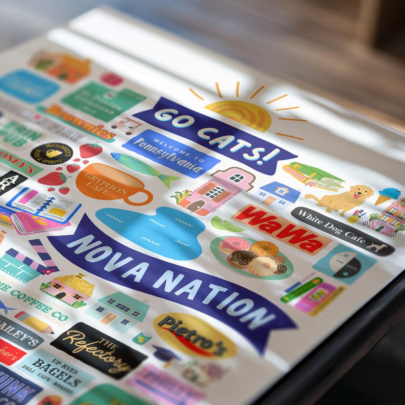 May include: A collection of colorful stickers with various designs and text, including "GO CATS!", "Welcome to Pennsylvania", "NOVA NATION", and "White Dog Cafe". The stickers feature illustrations of food, buildings, and a sun.