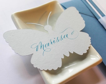 Place card in butterfly shape with hand lettered calligraphy customization | butterfly escort cards | die cut name cards for parties