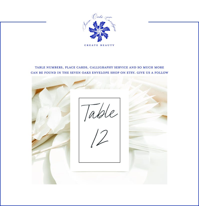 May include: A white table number card with the number 12 in black script, framed by a thin black border. The card is set against a backdrop of white flowers and soft, neutral tones. The top of the image features a blue floral logo and the words "CREATE BEAUTY".