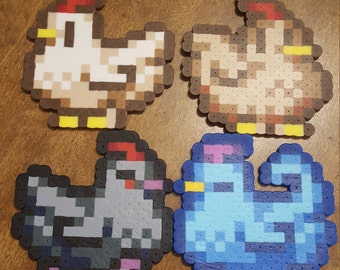 May include: Four pixel art animal figures made of colorful beads. A white chicken, a brown chicken, a gray chicken, and a blue bird.