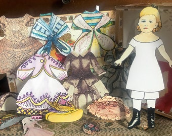 Nellie Victorian Paper Doll Set, including blonde doll, pre-cut 1800's style clothes, and wooden up-cycled cigar box