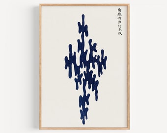 May include: A framed print with a dark blue abstract design in the center. The design is made up of irregular shapes that resemble dripping paint. The print is on a white background and has a wooden frame. The text "香取慎吾" is written in Japanese on the right side of the print.