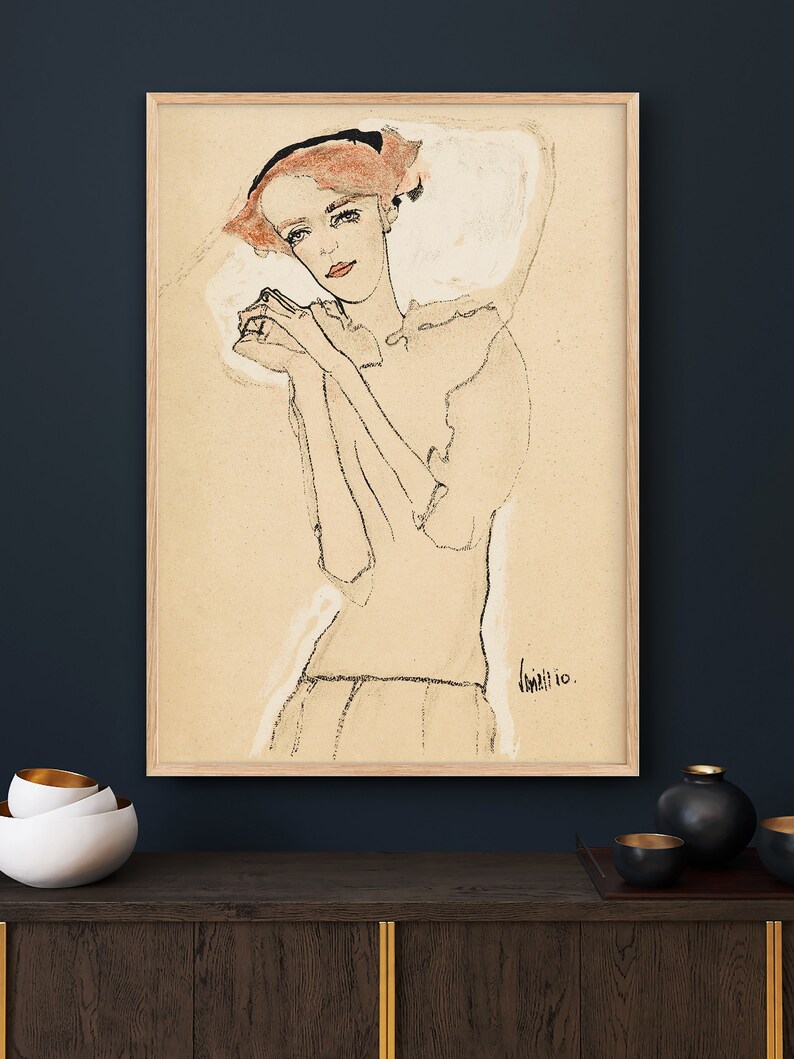May include: A black and white line drawing of a woman with red hair wearing a white dress. The drawing is on a beige background and is signed "Klimt 10."