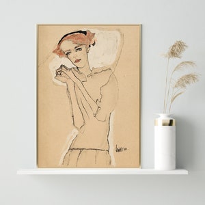 May include: A black and white line drawing of a woman with red hair wearing a white dress. The drawing is on a beige background and signed "Kall" in the bottom right corner.