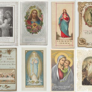May include: Collection of vintage religious cards featuring illustrations of Jesus, Mary, and other biblical scenes. The cards showcase various artistic styles, including detailed portraits and symbolic imagery, with ornate borders and text.