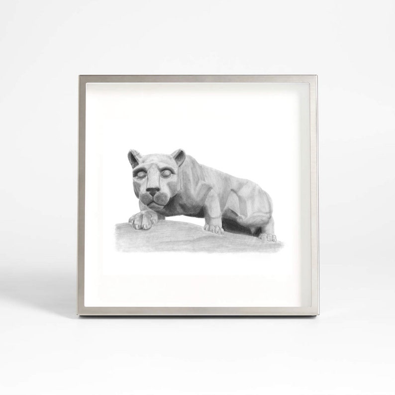 May include: A black and white pencil drawing of a lion statue in a silver frame.
