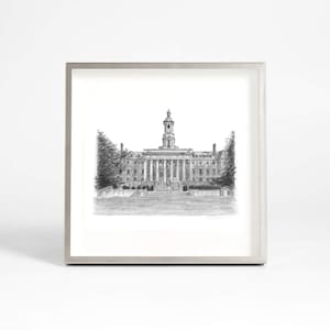 May include: A black and white pencil drawing of a large building with a clock tower. The building has a symmetrical design with multiple windows and columns. The drawing is framed in a silver frame.