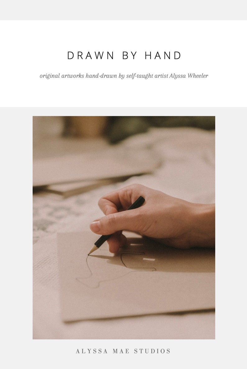May include: A hand draws a line on a piece of paper with a black pencil. The paper is on a table with other papers visible in the background. The image is in a warm, natural light.