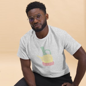 May include: A gray t-shirt with a green, yellow, and red graphic of a traditional Ethiopian coffee pot, called a jebena, made of words.