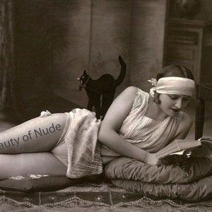 Half dressed girl reading, Boudoir print from 20s