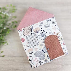 Doll bed inside fabric dollhouse, handmade bedding for dolls, sewing pattern details