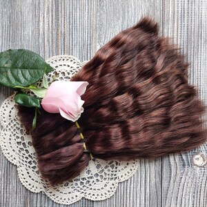Doll hair mohair curly locks closeup photo