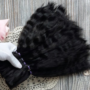 Handmade doll wig in progress using mohair hair