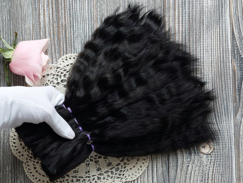 Handmade doll wig in progress using mohair hair