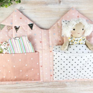 Fabric dollhouse interior with doll clothes storage pocket, soft quilted textile toy house