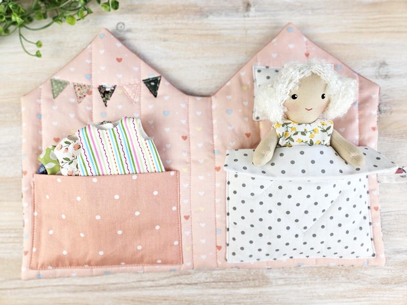 Fabric dollhouse interior with doll clothes storage pocket, soft quilted textile toy house