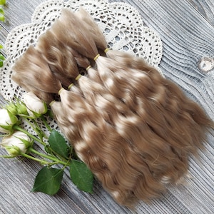 Doll hair. Made from natural Angora goat hair. Perfectly suitable as a hair for dolls. Mohair doll hair is also great for making doll wigs.