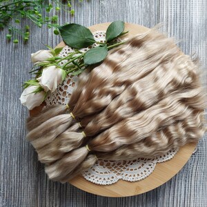 Doll hair. Made from natural Angora goat hair. Perfectly suitable as a hair for dolls. Mohair doll hair is also great for making doll wigs.