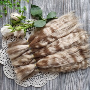 Doll hair. Made from natural Angora goat hair. Perfectly suitable as a hair for dolls. Mohair doll hair is also great for making doll wigs.