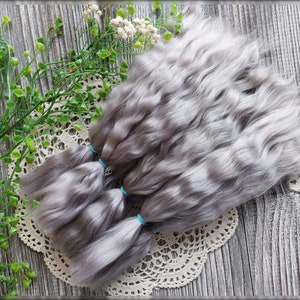 Curly hand dyed mohair doll hair closeup