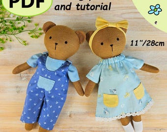 May include: Two handmade brown bear dolls, each approximately 11 inches (28cm) tall, wearing blue outfits. One doll has overalls, the other a dress with yellow pockets. The image includes the text "PDF sewing pattern and tutorial" and "BEAR DOLL + clothes".