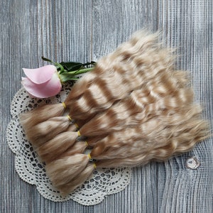 Doll hair. Made from natural Angora goat hair. Perfectly suitable as a hair for dolls. Mohair doll hair is also great for making doll wigs.