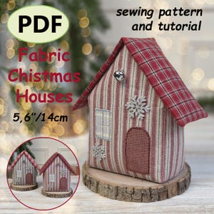 May include: A PDF sewing pattern and tutorial for fabric Christmas houses measuring 5.6 inches. The house features a red and white striped body, a red plaid roof, a small silver bell, a rectangular window, a rounded door, and silver snowflake accents.