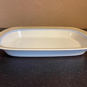 May include: A set of three ceramic mugs with a speckled, matte finish. The mugs are in shades of cream, light gray, and dark gray. Each mug has a simple, minimalist design, perfect for coffee or tea.