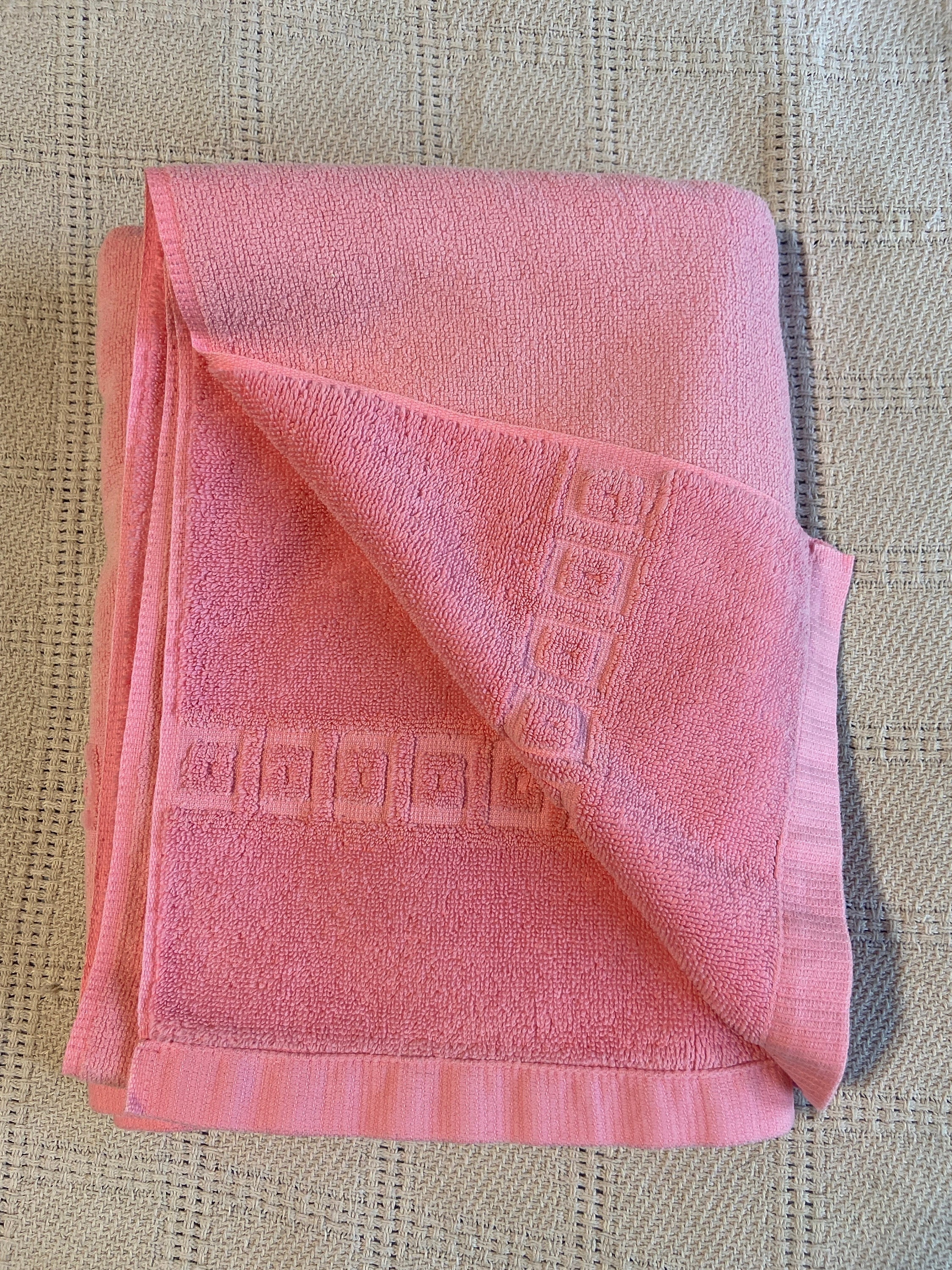 Vintage 1970s Fieldcrest Bath Towel -- Bubble Gum Pink with Sculpted Terry Squares-Within-Squares Decorating the Edges. Marked "Irregular."