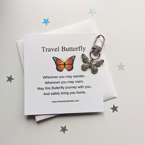 May include: A silver butterfly keychain with a card that reads "Travel Butterfly" and a poem about safe travels. The card has a picture of an orange and black butterfly.