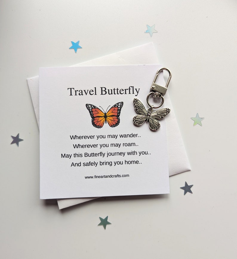 May include: A silver butterfly keychain with a card that reads "Travel Butterfly" and a poem about safe travels. The card has a picture of an orange and black butterfly.