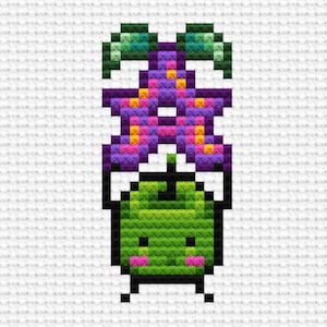 May include: A green pixelated character with a pink flower on its head. The flower has purple, pink, and yellow petals. The character has a happy expression and is standing on a white background.