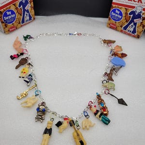 One of a kind, Cracker Jack, Antique Celluoid/ Plastic, Assorted Charm,  Necklace.