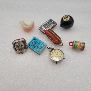 SELECT a Cracker Jack Charm/ Prize. Each sold separately.