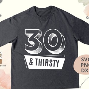 May include: Dark gray t-shirt with the number "30" and the words "& THIRSTY" in white. The design has a retro, halftone effect. The shirt is a casual wear item.