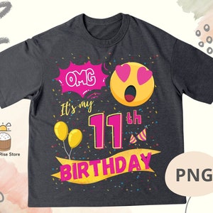 K&ouml;nnte beinhalten: Ein dunkelgraues T-Shirt mit einem pinkfarbenen und gelben Geburtstagsdesign. Das Design zeigt ein Cartoon-Gesicht mit Herzen als Augen, den Text "OMG It's my 11th Birthday" und Konfetti.