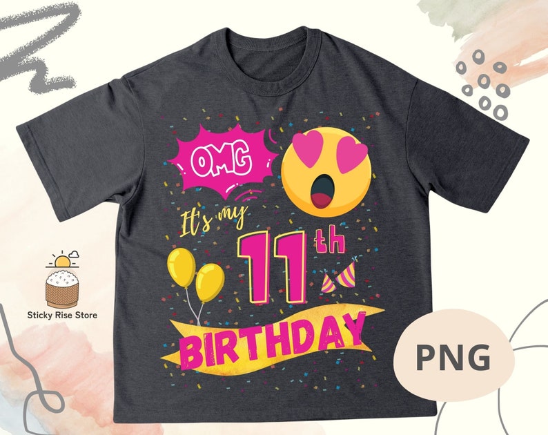K&ouml;nnte beinhalten: Ein dunkelgraues T-Shirt mit einem pinkfarbenen und gelben Geburtstagsdesign. Das Design zeigt ein Cartoon-Gesicht mit Herzen als Augen, den Text "OMG It's my 11th Birthday" und Konfetti.