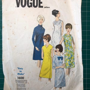 May include: Vintage Vogue sewing pattern number 1600 for a basic dress. The pattern shows five different dress styles, including a yellow sleeveless dress, a blue dress with a bow, and a floral print dress.