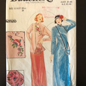 May include: Vintage Butterick sewing pattern featuring a Kenzo design. The pattern shows two women in long, flowing dresses and includes illustrations of floral embroidery. The bust size is 34 inches (87cm).