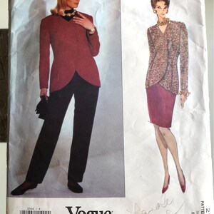 May include: A vintage Vogue Patterns sewing pattern for a jacket and skirt by Anne Klein. The pattern is for sizes 8-10-12. The pattern is printed on white paper with a red and black color scheme.