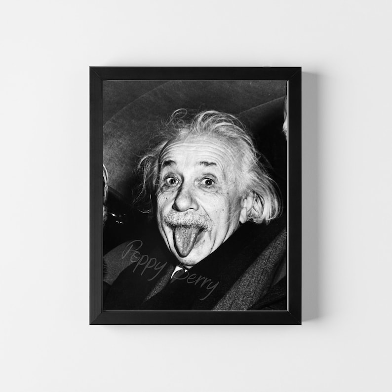 May include: Black and white photo of Albert Einstein sticking his tongue out. The photo is signed "Poppy Berry".