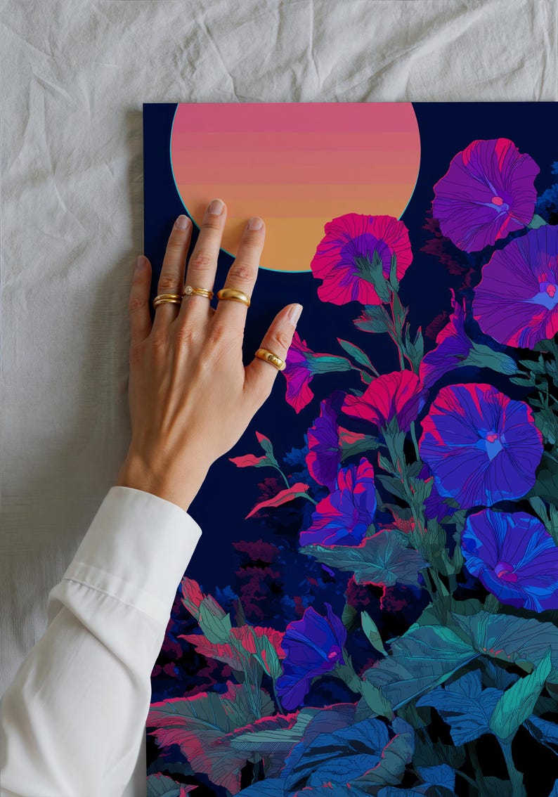 May include: A vibrant floral art print featuring stylized morning glory flowers in shades of purple, pink, and blue against a dark blue background. A gradient of pink and orange suggests a sunset or sunrise. Gold rings adorn the fingers.